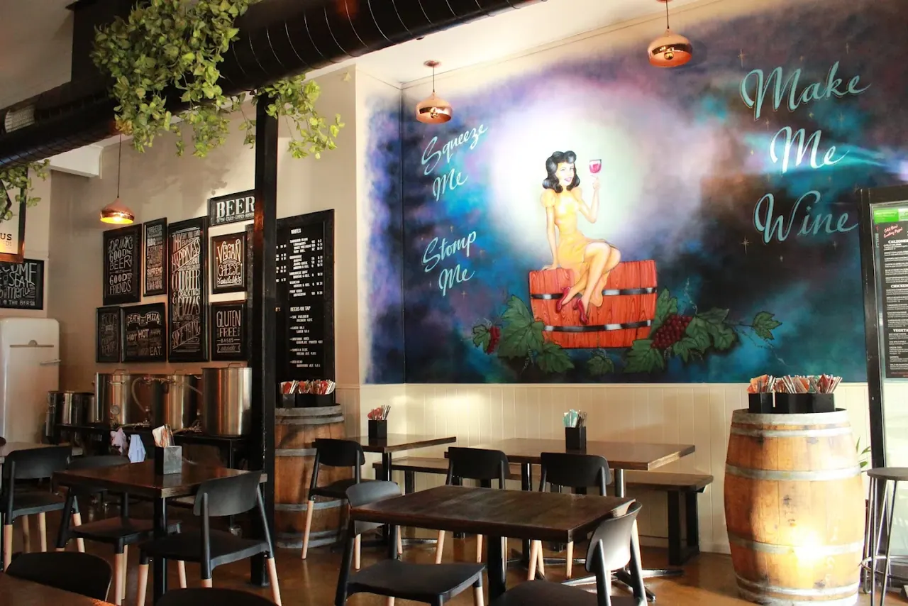 Stone & Brew’s mural, timber tables and warm interior lighting
